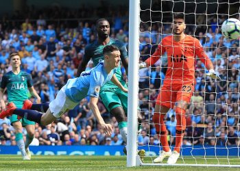 Phil Foden (airborne) of Manchester City scores his maiden Premier League goal against Tottenham Hotspur, Saturday