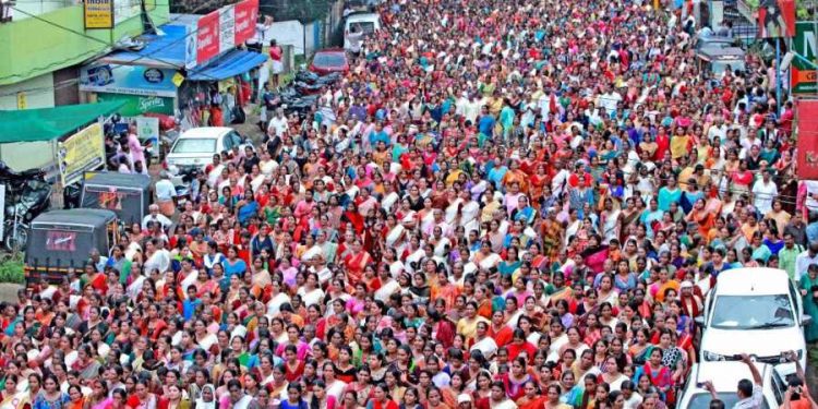 Hundreds of devotees, mostly women, take part in the 'namajapa' (chanting the name of Lord Ayyappa ) during march in Kottayam, Kerala (PTI photo)