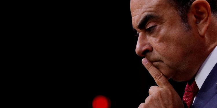 FILE PHOTO: Carlos Ghosn then Chairman and CEO of the Renault-Nissan Alliance, reacts during a news conference in Paris, France, September 15, 2017. REUTERS/Philippe Wojazer/File Photo