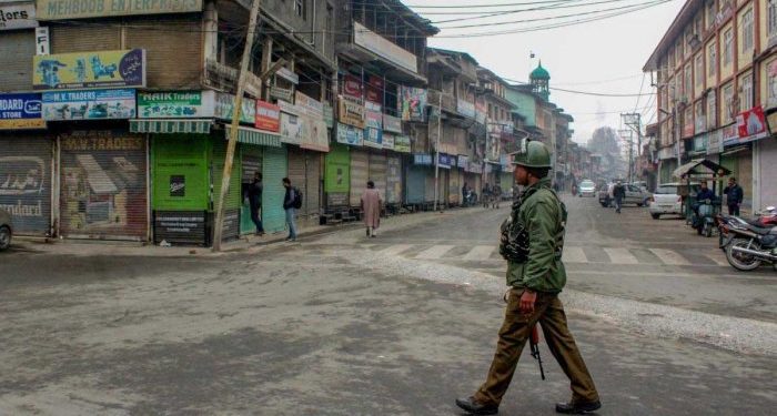 The curfew was promulgated in the town and adjoining areas Tuesday after RSS leader Chanderkant Sharma and his security guard was shot dead by militants at a health centre.