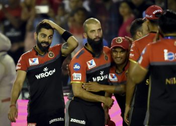Virat Kohli (L) and his teammates celebrate after RCB's win over KXIP at Mohali, Saturday