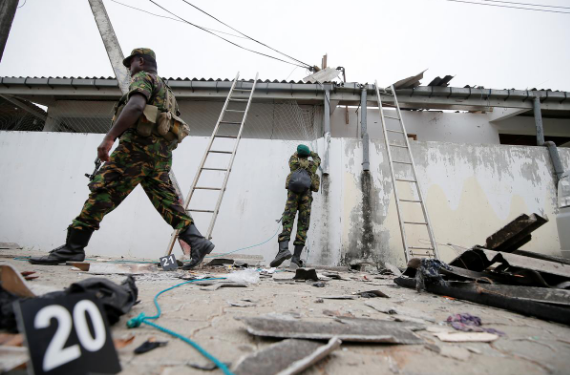 Security personnel at the site of gun battle between troops and suspected Islamist militants, on the east coast of Sri Lanka, in Kalmunai, Saturday