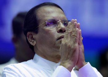 FILE PHOTO: Sri Lanka's President Maithripala Sirisena prays during a special party convention in Colombo, Sri Lanka December 4, 2018. REUTERS/Dinuka Liyanawatte