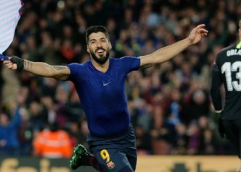 Luis Suarez celebrates after scoring Barcelona’s opening goal against Atletico Madrid, Saturday