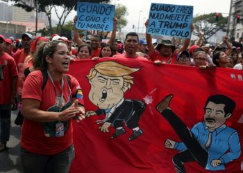 Supporters of Venezuelan President Nicolas Maduro take part in a pro-government "Anti-Imperialist March" in Caracas (AFP)