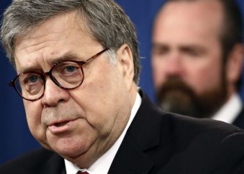 Attorney General William Barr speaks alongside Deputy Attorney General Rod Rosenstein about the release of a redacted version of special counsel Robert Mueller's report during a news conference, Thursday, April 18, 2019, at the Department of Justice in Washington. (Patrick Semansky / AP)