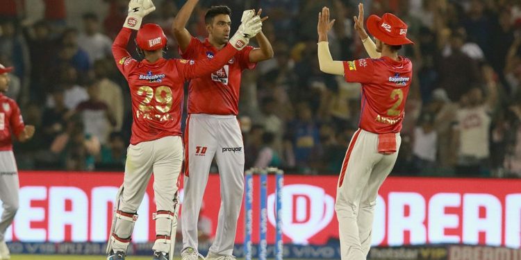 R Ashwin (C) celebrates with teammates after dismissing an opposition batsman, Tuesday