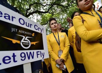 Jet Airways employees hold placards as they gather to make an appeal to save the airline after it announced temporary suspension of flight operations, in New Delhi (PTI photo)