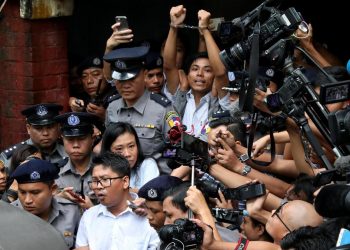 Detained Reuters journalists Wa Lone and Kyaw Soe Oo leave Insein court after listening to the verdict in Yangon. (Reuters photo)