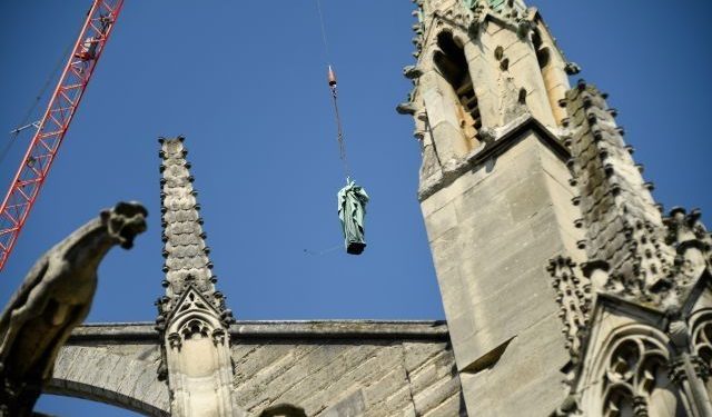 Tourists at the world-famous landmark were left stunned Thursday as the statues -- representing the 12 apostles and the four evangelists from the New Testament -- were lifted off the spire of the cathedral by crane. (Image: Yahoo)