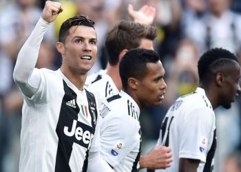 Cristiano Ronaldo (L) and other Juventus players celebrate after sealing their eighth Serie A title, Saturday