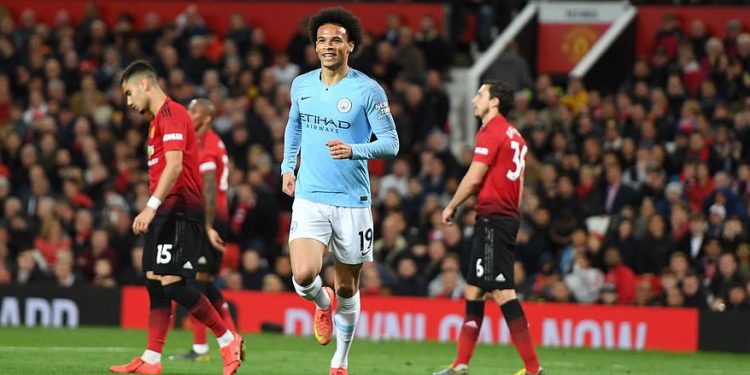 Leroy Sane (in blue) celebrates after scoring Manchester City’s second goal against Manchester United, Wednesday