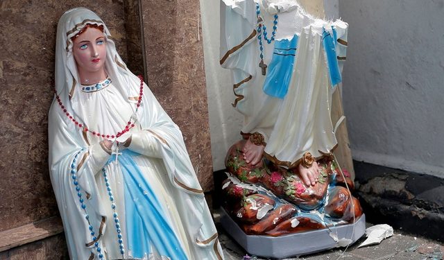 A statue of Virgin Mary broken in two parts seen at one of the churches where the explosions took place. (Image: Reuters)