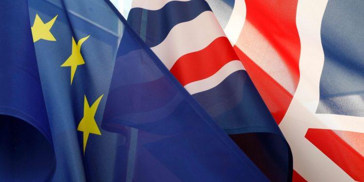 The flags of Britain (R) and the European Union flutter in front of the Chancellery in Berlin (AFP)