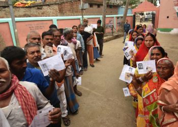 Voters stand in queue to cast their voters in Jharkhand