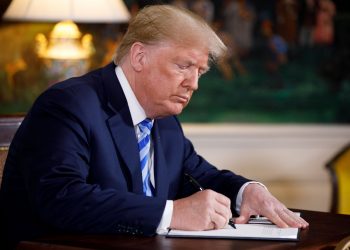 WASHINGTON, May 8, 2018 (Xinhua) -- U.S. President Donald Trump signs a presidential memorandum at the White House in Washington D.C., the United States, on May 8, 2018. U.S. President Donald Trump said here on Tuesday that the United States will withdraw from the Iran nuclear deal, a landmark agreement signed in 2015. (Xinhua/Ting Shen/IANS)