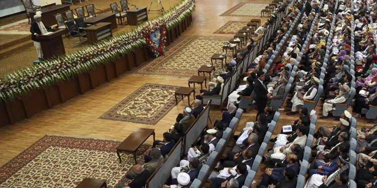 Kabul: Afghan President Ashraf Ghani, left, speaks during the first day of the Afghan Loya Jirga meeting in Kabul, Afghanistan, Monday, April 29, 2019.  Afghanistan's president Ashraf Ghani opened the Loya Jirga grand council on Monday with more than 3,200 prominent Afghans attending to seek an agreed common approach for future peace talks with the Taliban, but the gathering may further aggravate divisions within the U.S.-backed government. AP/PTI(AP4_29_2019_000081B)
