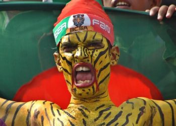 The 31-year-old Dhaka car mechanic, known at grounds worldwide for his distinctive tiger body and face paint, has injured himself, paid a bribe and spent his life savings to pursue his passion for the game.