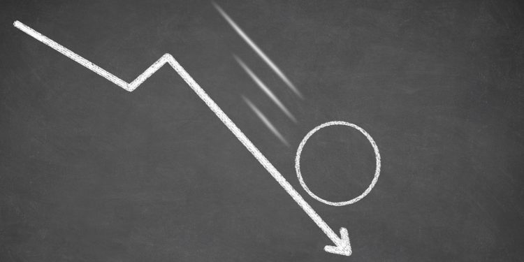Line graph with an empty circle showing a downward trend. White chalk on blackboard