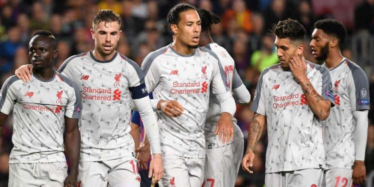 Liverpool players react after their loss to Barcelona, Wednesday