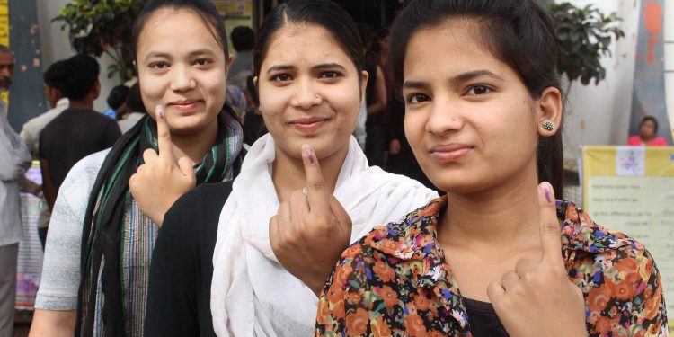 First time voters in Bhopal show their inked fingers after casting their votes, Sunday