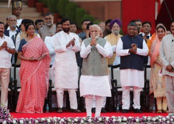 India's Prime Minister Narendra Modi gestures towards supporters after his oath during a swearing-in ceremony at the presidential palace in New Delhi, India May 30, 2019. REUTERS/Adnan Abidi