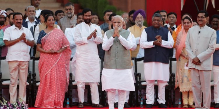 India's Prime Minister Narendra Modi gestures towards supporters after his oath during a swearing-in ceremony at the presidential palace in New Delhi, India May 30, 2019. REUTERS/Adnan Abidi