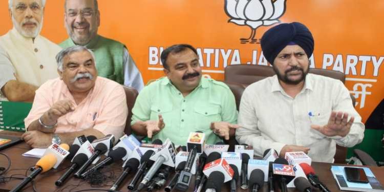 Vikram Randhawa (C) and other BJP leaders talk to the media, Thursday