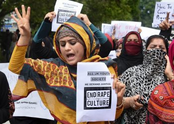 Srinagar: Protesters hold placards as they shout slogans during a protest against the alleged rape of a three-year-old girl by a local in Bandipora district of Jammu and Kashmir, in Srinagar, Monday, May 13, 2019. (PTI Photo/S. Irfan)(PTI5_13_2019_000082B)