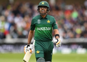 Babar Azam walks back to the pavilion after getting out for 22.