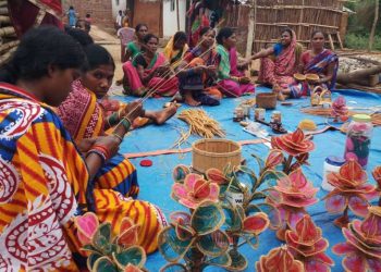 Womenfolk creating paddy artworks in Khudapej village of Nuapada district in Odisha.