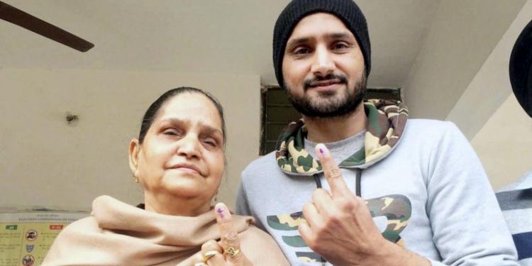 Cricketer Harbhajan Singh casts vote at a polling booth in Jalandhar
