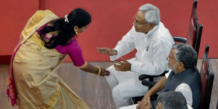 Patna: Bihar Chief Minister Nitish Kumar greets newly-inducted minister Vima Bharti during the swearing-in ceremony for the cabinet expansion of coalition government of NDA, in Patna, Sunday, June 2, 2019. (PTI Photo) (PTI6_2_2019_000031B)