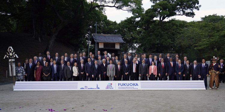 Fukuoka : Japan's Finance Minister Taro Aso, center, poses with the delegation members during a family photo of the G20 finance ministers and central bank governors meeting Saturday, June 8, 2019, in Fukuoka, Japan. The G20 finance ministers and central bank governors meeting is taking place in Fukuoka June 8-9.  AP/PTI(AP6_8_2019_000093B)
