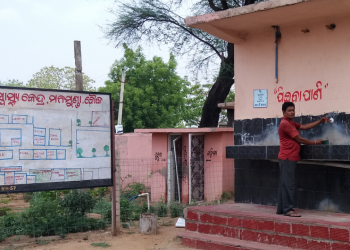 The defunct water project. An attendant opens a tap only to find that it does not work anymore