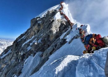 TOPSHOT - This handout photo taken on May 22, 2019 and released by climber Nirmal Purja's Project Possible expedition shows heavy traffic of mountain climbers lining up to stand at the summit of Mount Everest. - Many teams had to line up for hours on May 22 to reach the summit, risking frostbites and altitude sickness, as a rush of climbers marked one of the busiest days on the world's highest mountain. (Photo by Handout / Project Possible / AFP) / RESTRICTED TO EDITORIAL USE - MANDATORY CREDIT "AFP PHOTO / PROJECT POSSIBLE" - NO MARKETING NO ADVERTISING CAMPAIGNS - DISTRIBUTED AS A SERVICE TO CLIENTS ---HANDOUT/AFP/Getty Images