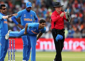 Bhuvneshwar Kumar stretches after suffering a hamstring niggle during the game against Pakistan