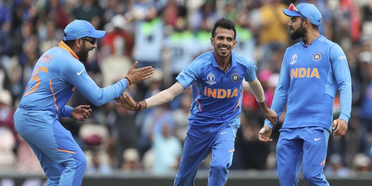 Yuzvendra Chahal (centre) celebrates with Rohit Sharma and Virat Kohli after dismissing a South African batsman, Wednesday
