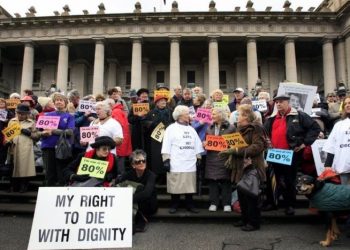 Protesters rally outside the Victorian Parliament, calling for voluntary euthanasia.