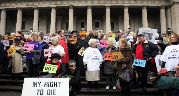 Protesters rally outside the Victorian Parliament, calling for voluntary euthanasia.