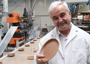 Jerzy Wysocki holds a wheat bran plate at his factory in Zambrow, Poland