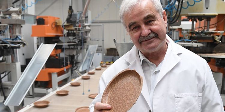 Jerzy Wysocki holds a wheat bran plate at his factory in Zambrow, Poland