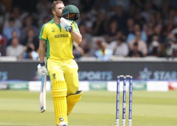 Aaron Finch kisses his helmet after reaching the three-figure mark against England, Tuesday