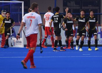 Japanese players celebrate after scoring a goal against South Africa, Wednesday