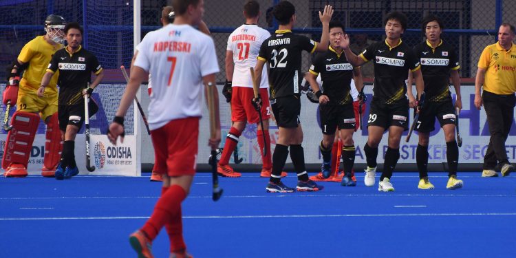 Japanese players celebrate after scoring a goal against South Africa, Wednesday