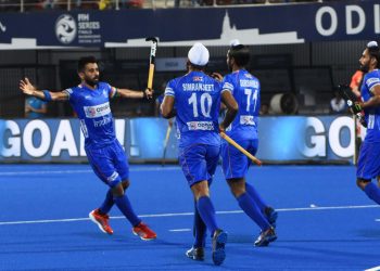 Skipper Manpreet Singh (L) celebrates with teammates after scoring against Poland at the Kalinga Stadium, Friday