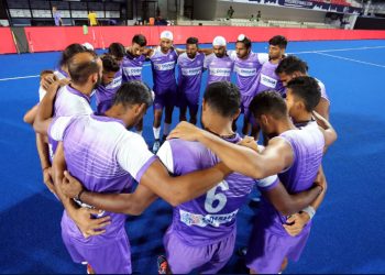 Players of the Indian men's hockey team go into a huddle during their training session, Wednesday