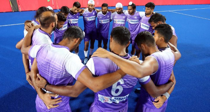 Players of the Indian men's hockey team go into a huddle during their training session, Wednesday