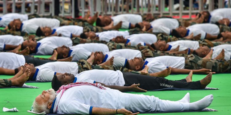 Prime Minister Narendra Modi performs yoga at a function in Ranchi to mark International Yoga Day