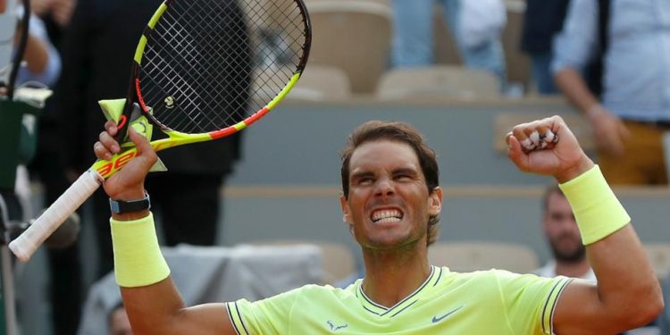 Rafa Nadal celebrates his victory over Roger Federer at Roland Garros, Friday